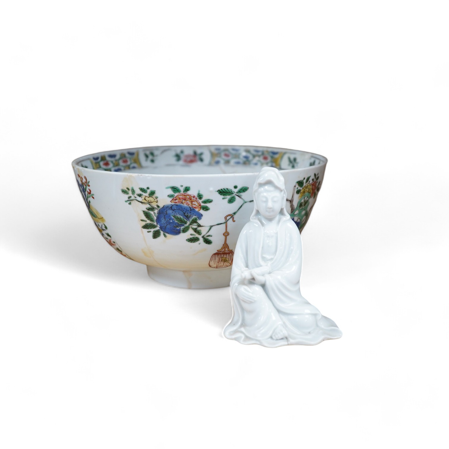 A Chinese famille verte bowl, Kangxi period and a white glazed figure of Guanyin, bowl 22cm diameter. Condition - figure good, bowl poor